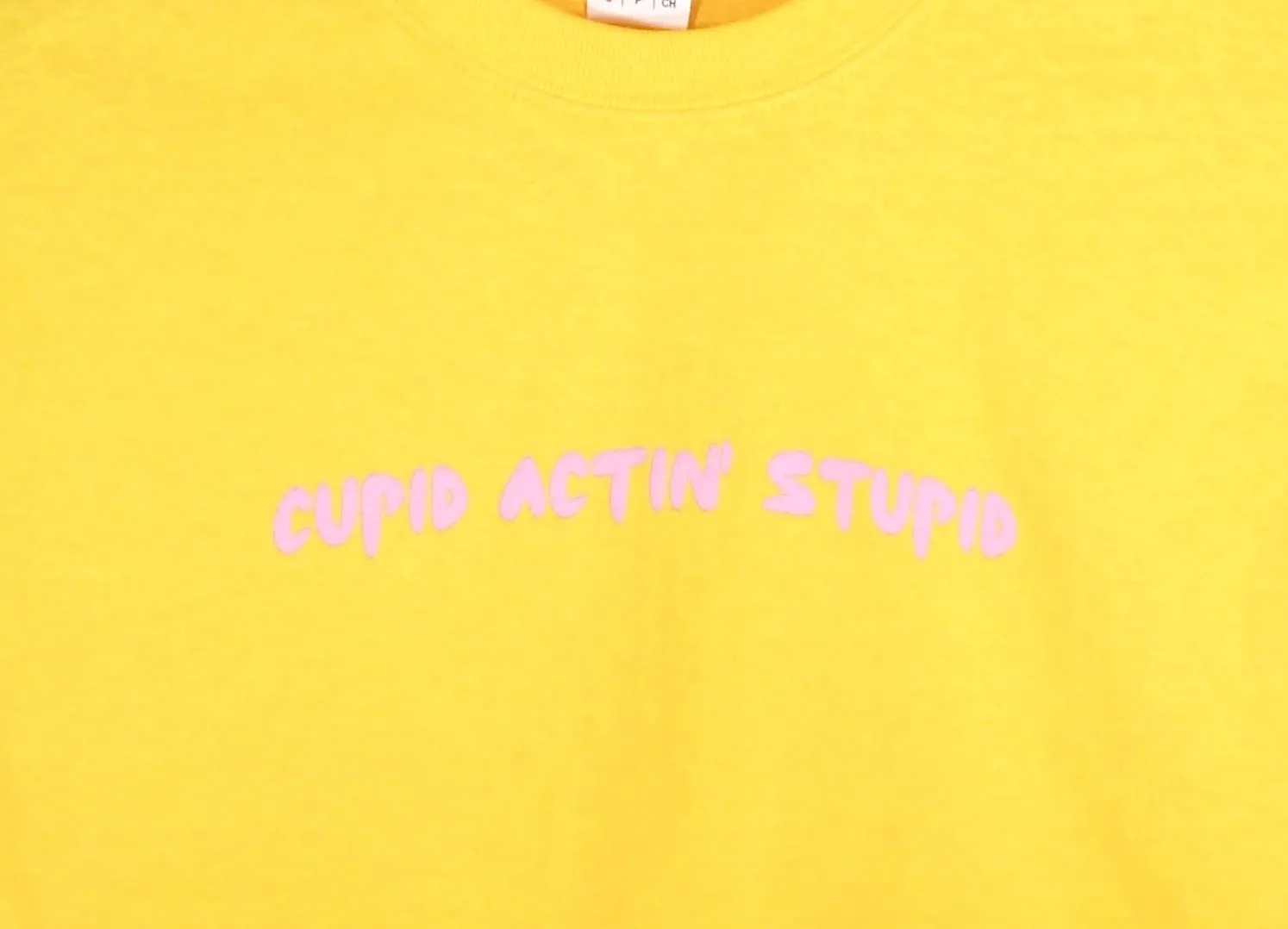 Cupid Actin' Stupid Yellow Graphic Unisex Cropped Tee